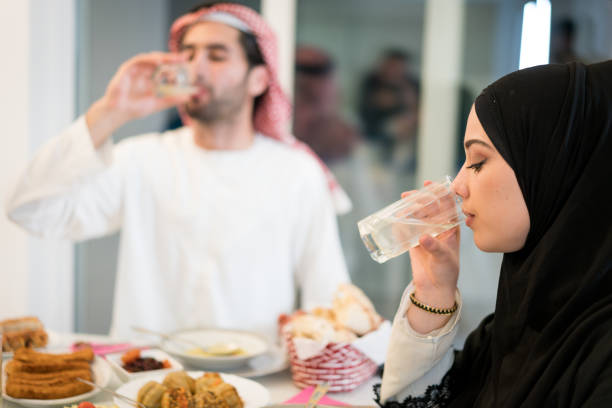 Muslim Family Drinking Water For Breaking Ramadan Fasting